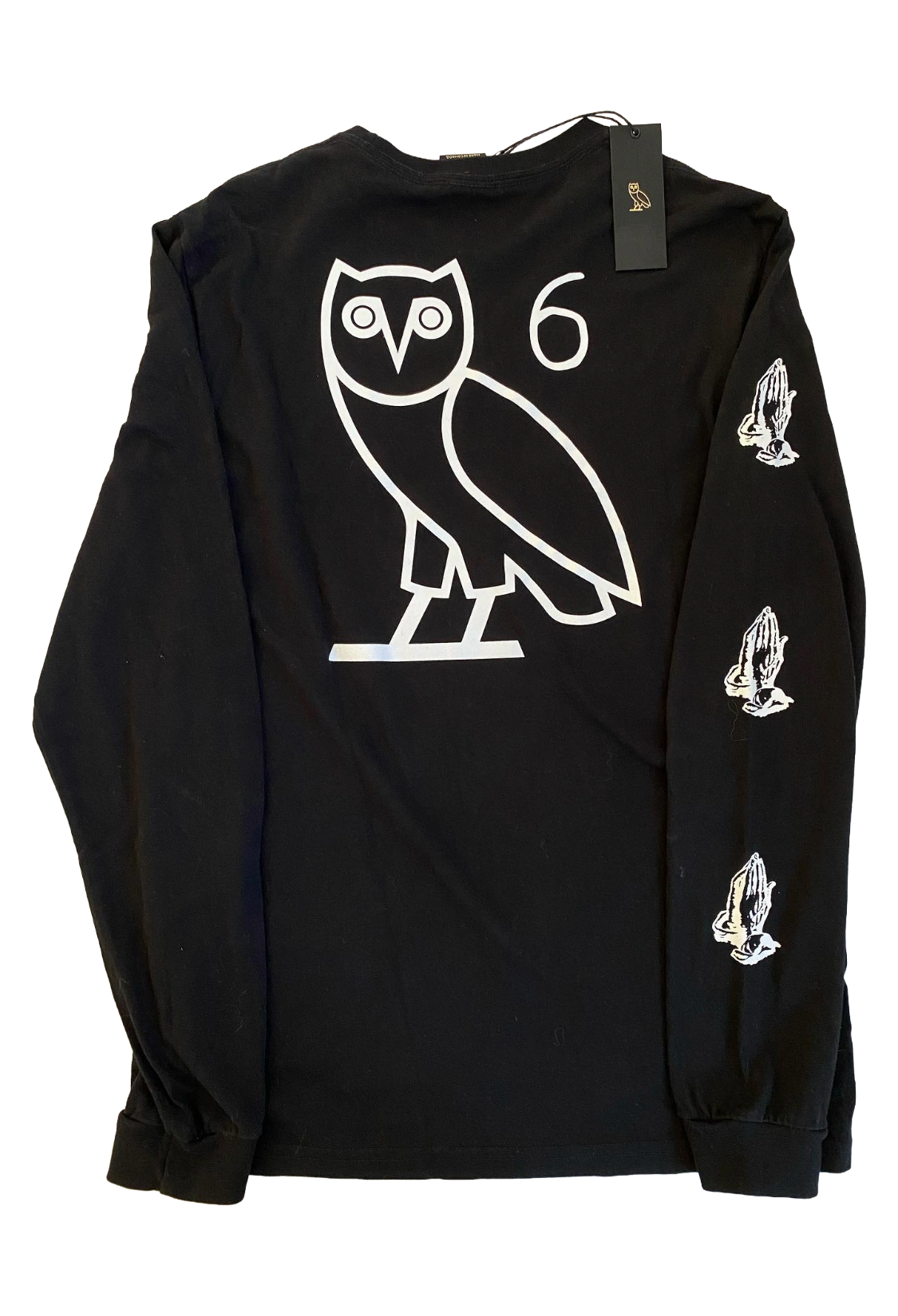 Black long-sleeve shirt with white owl logo and praying hands on a white background OVO 6 God Longsleeve Shirt