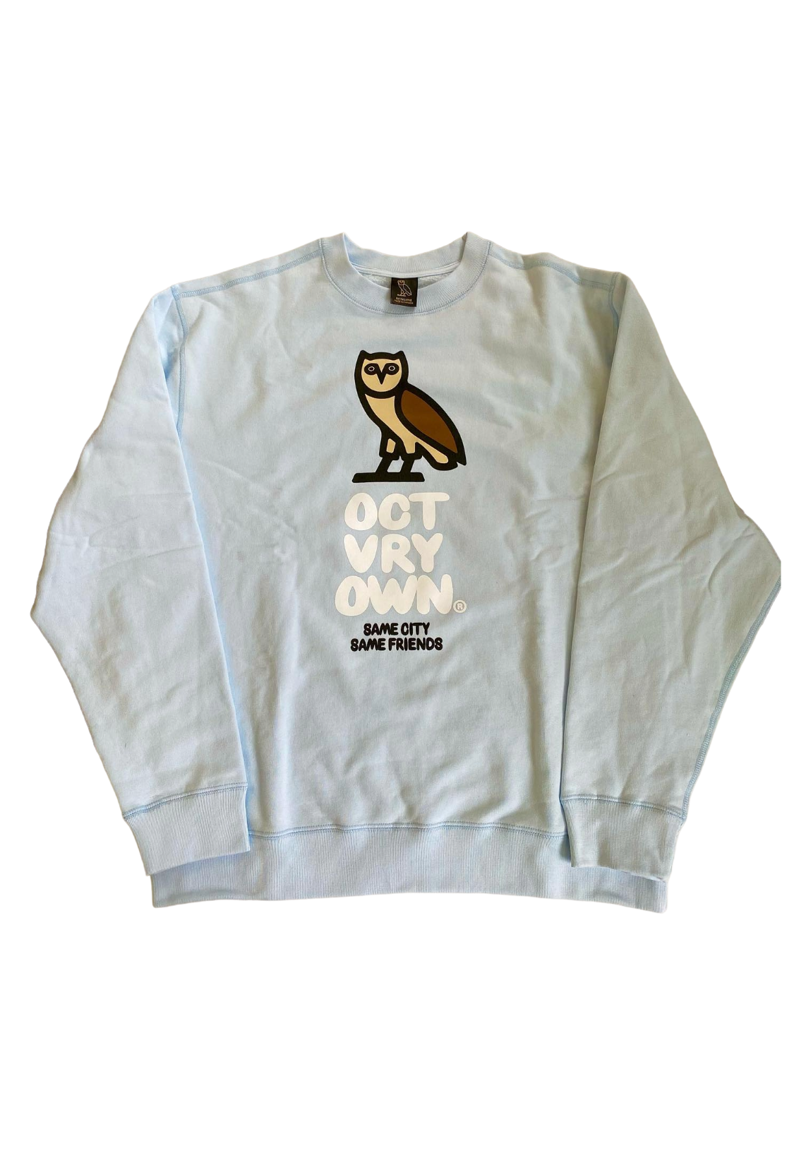White sweatshirt with owl graphic and text on a white background OVO Bubble Owl Crewneck