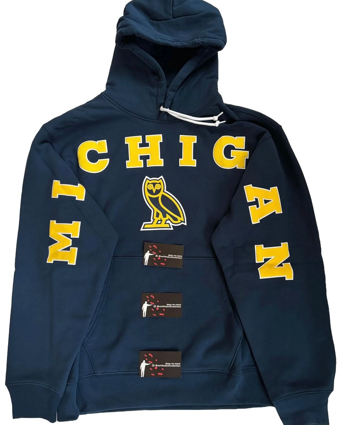 Navy hoodie with 'Michigan' text and a logo on a white background