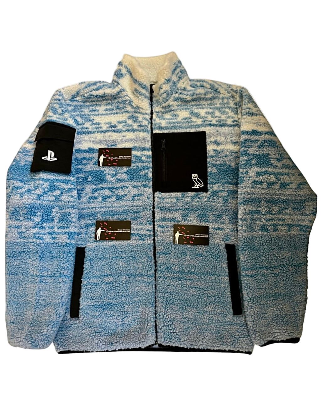 Blue patterned jacket with brand labels on a white background
