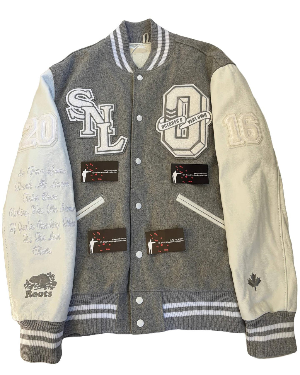 Gray and white varsity jacket with various patches and logos on a white background