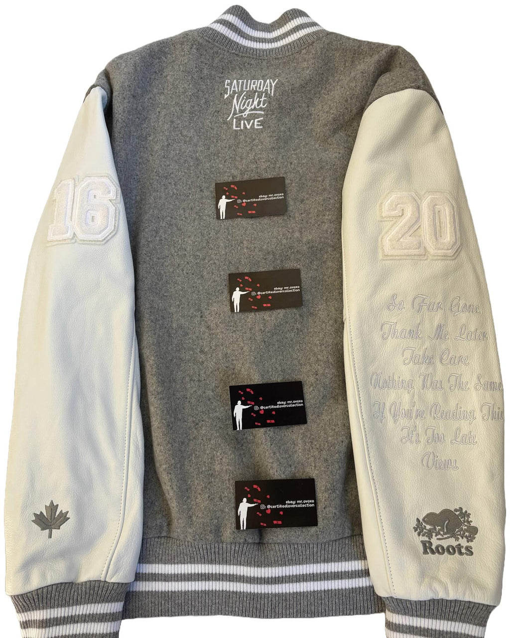 Gray and beige varsity jacket with text and branding on a white background