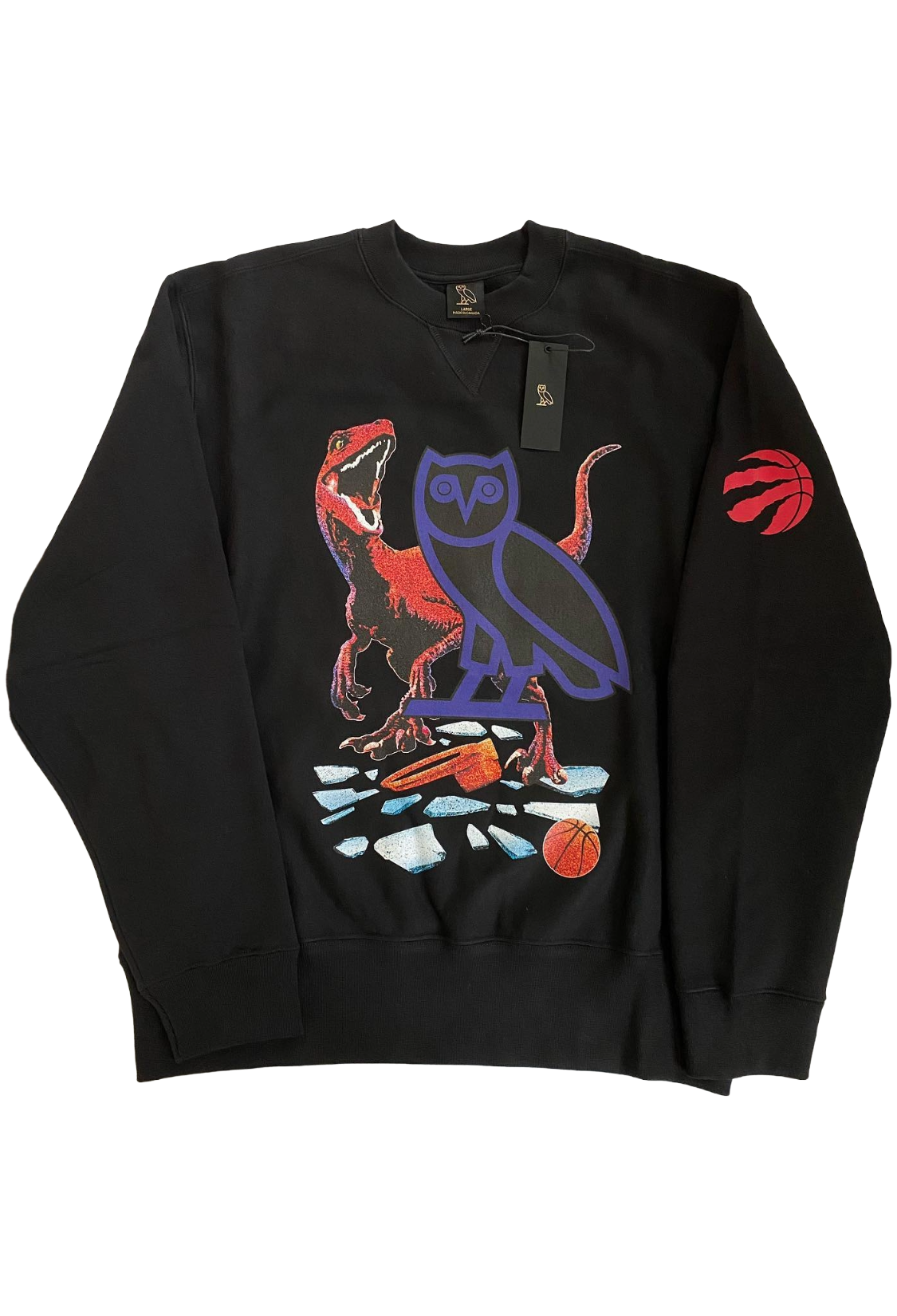 Black sweatshirt with colorful graphic design on a white background. OVO X Toronto Raptors X Jurassic Park X Dino Shattered Backboard Crewneck