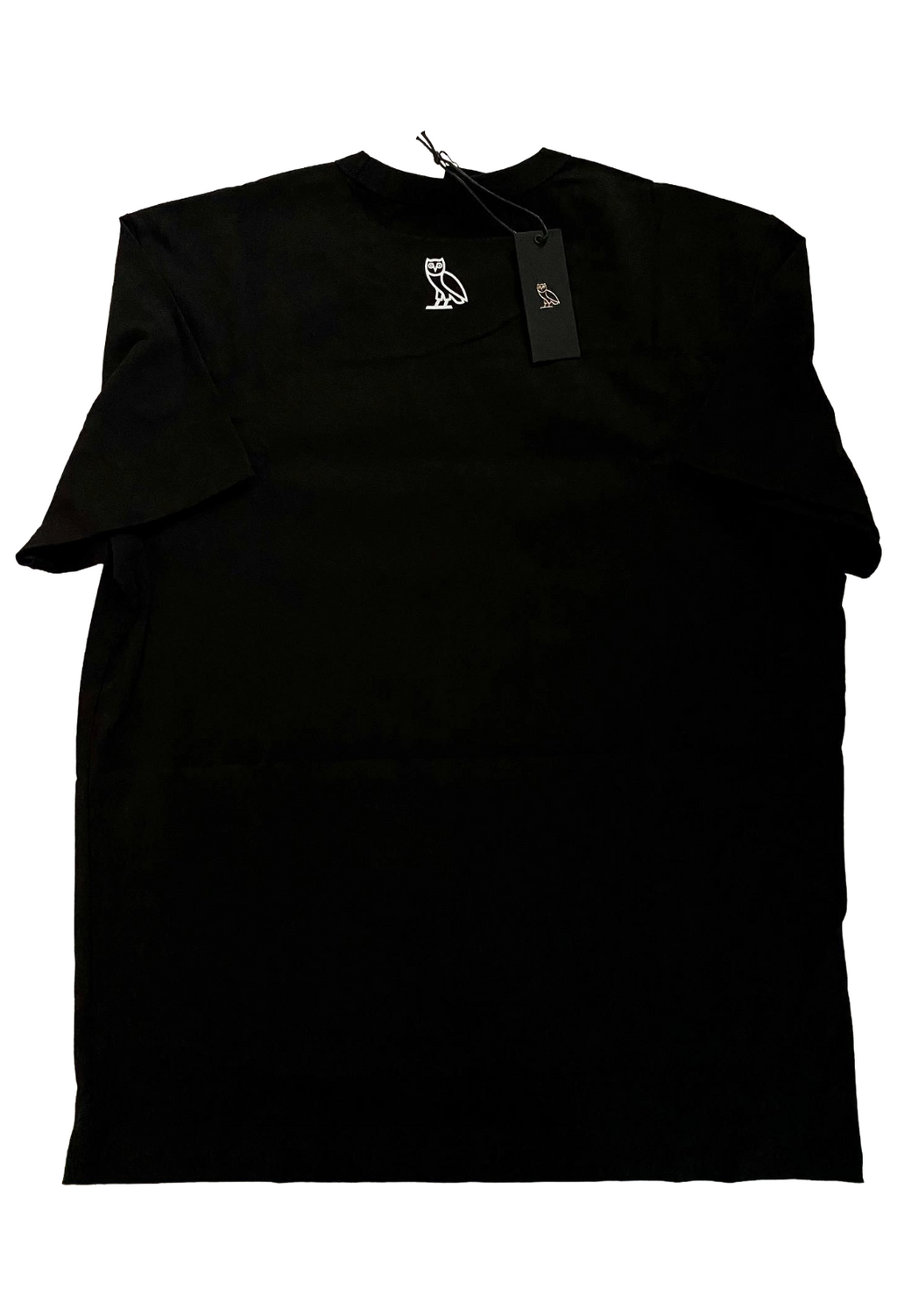 Black sleeveless top with a tag on a white background