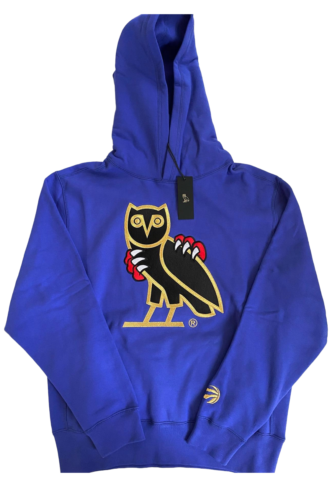 Blue hoodie with a logo on a white background. OVO x Jurassic Park x Raptors OG Owl Hoodie 2021