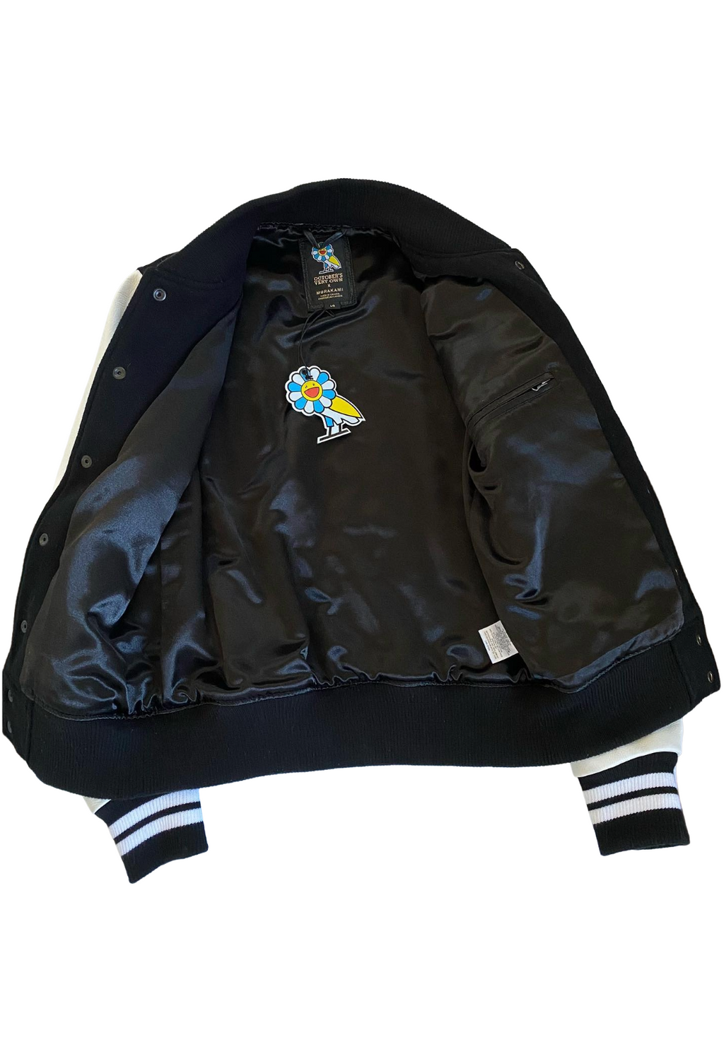 Black jacket with colorful bird design on a white background OVO x Takashi Murakami Leather Wool Varsity Jacket